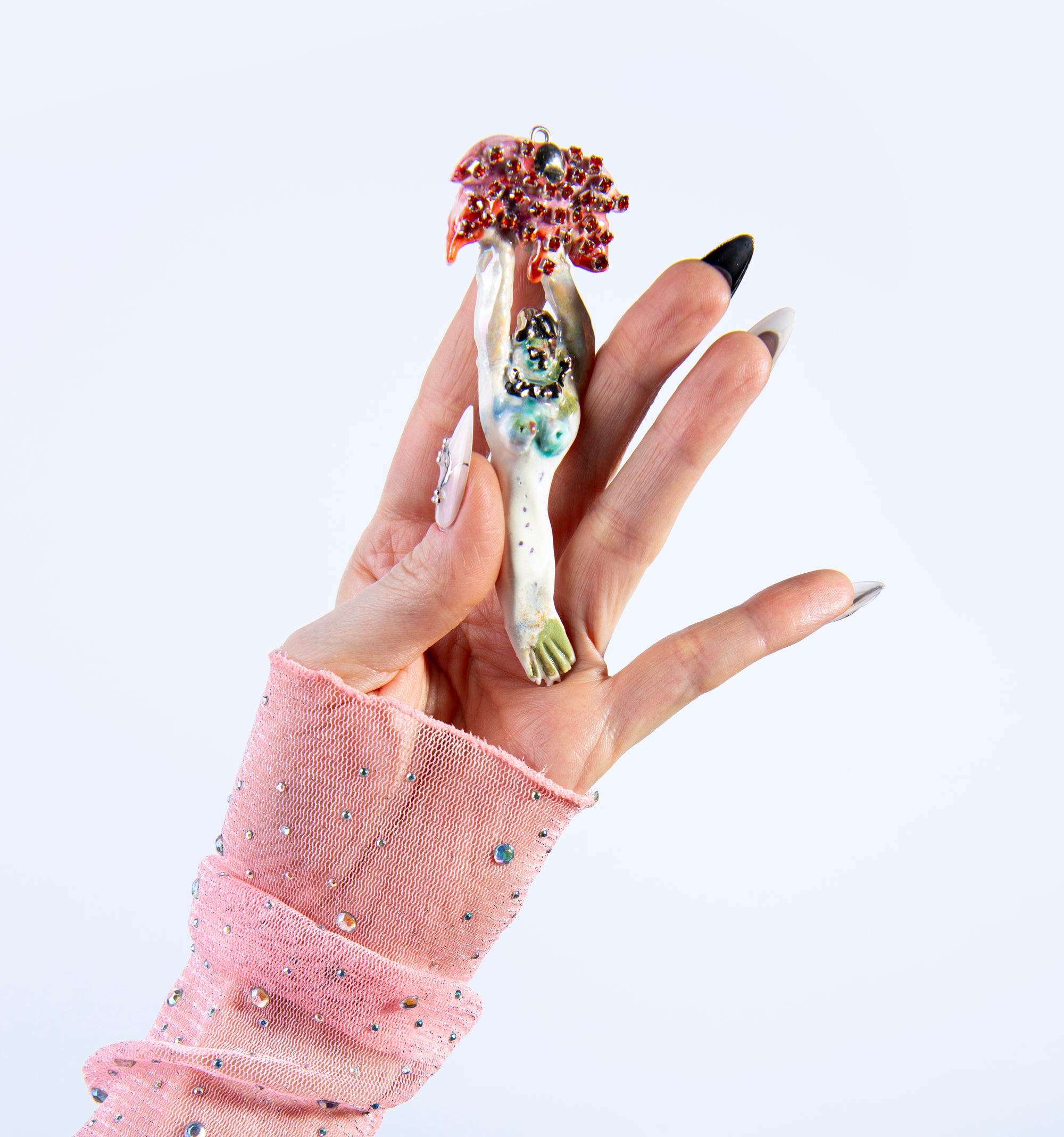 Mermaid carrying red flower charm