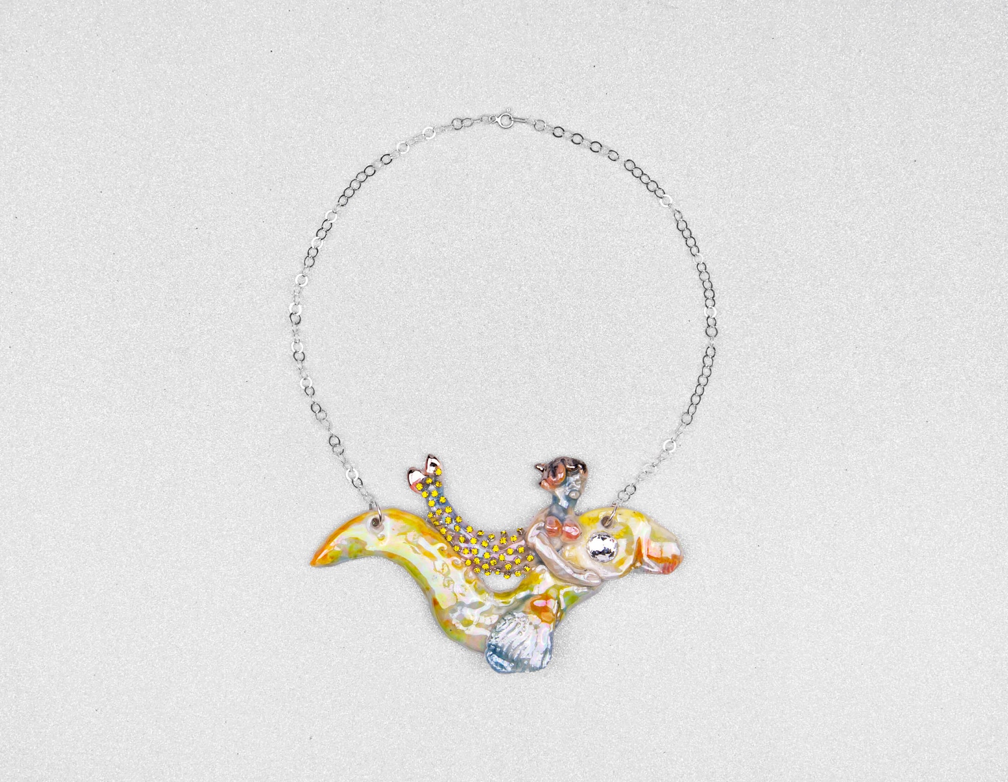 Mermaid riding yellow sea snake