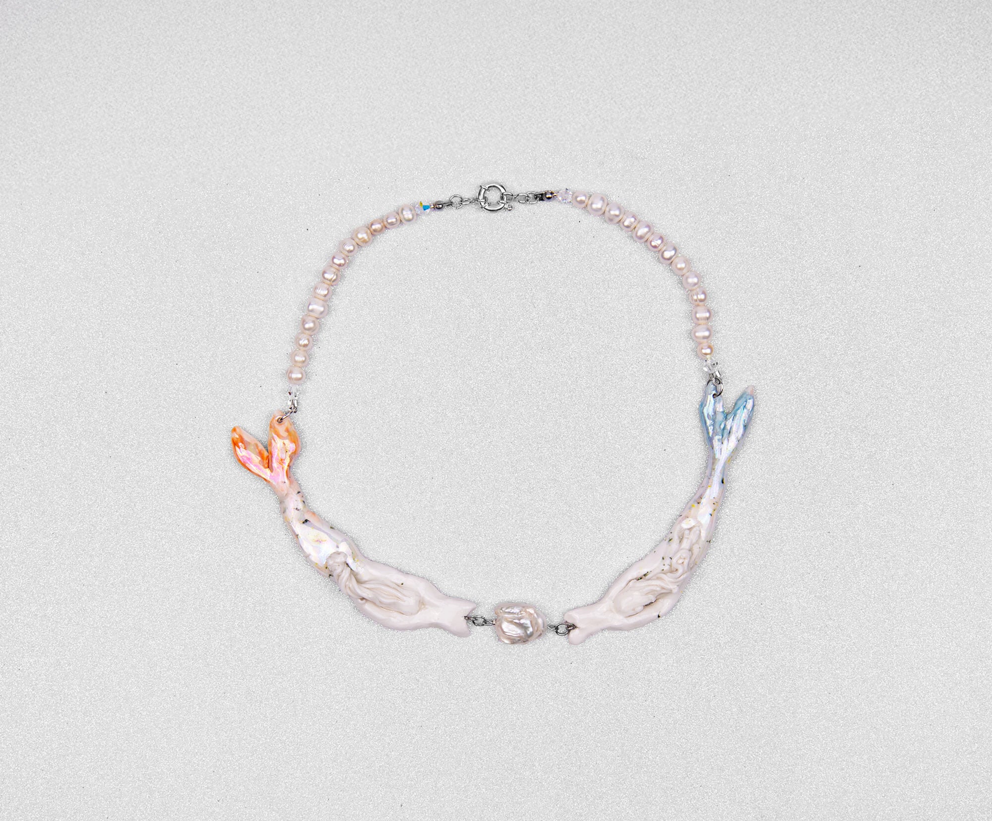 Pastel mermaids with big pearl necklace