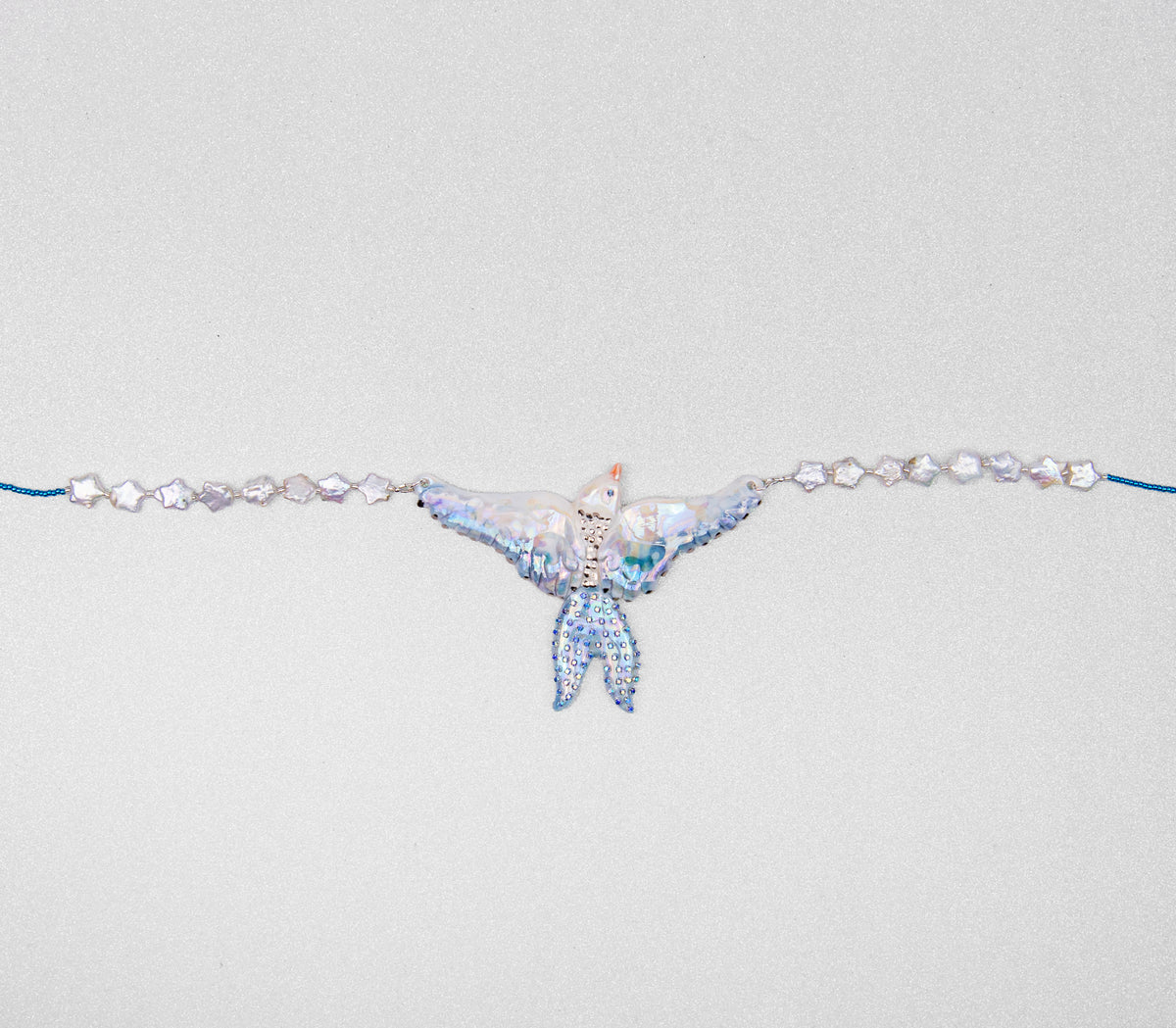 Celestial bird with pearl stars necklace