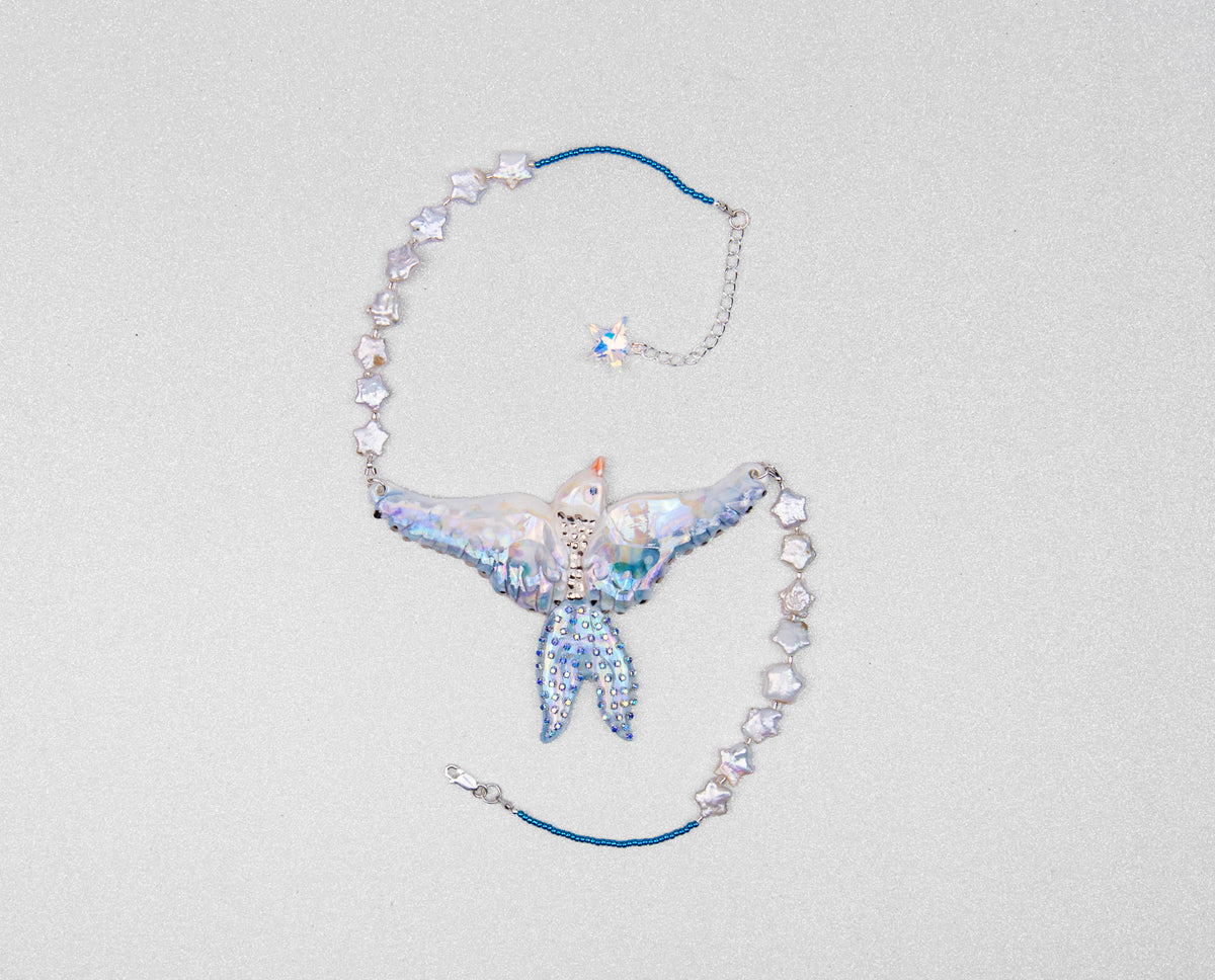 Celestial bird with pearl stars necklace