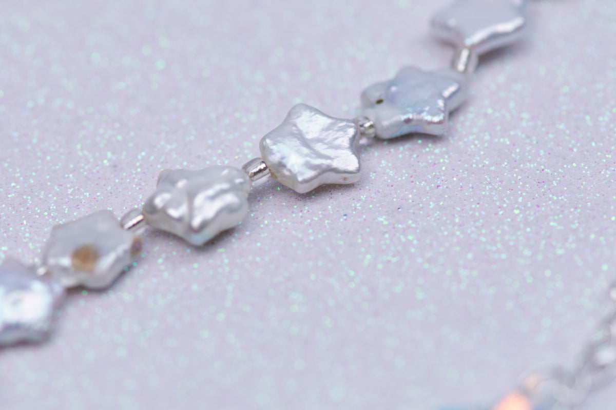 Celestial bird with pearl stars necklace