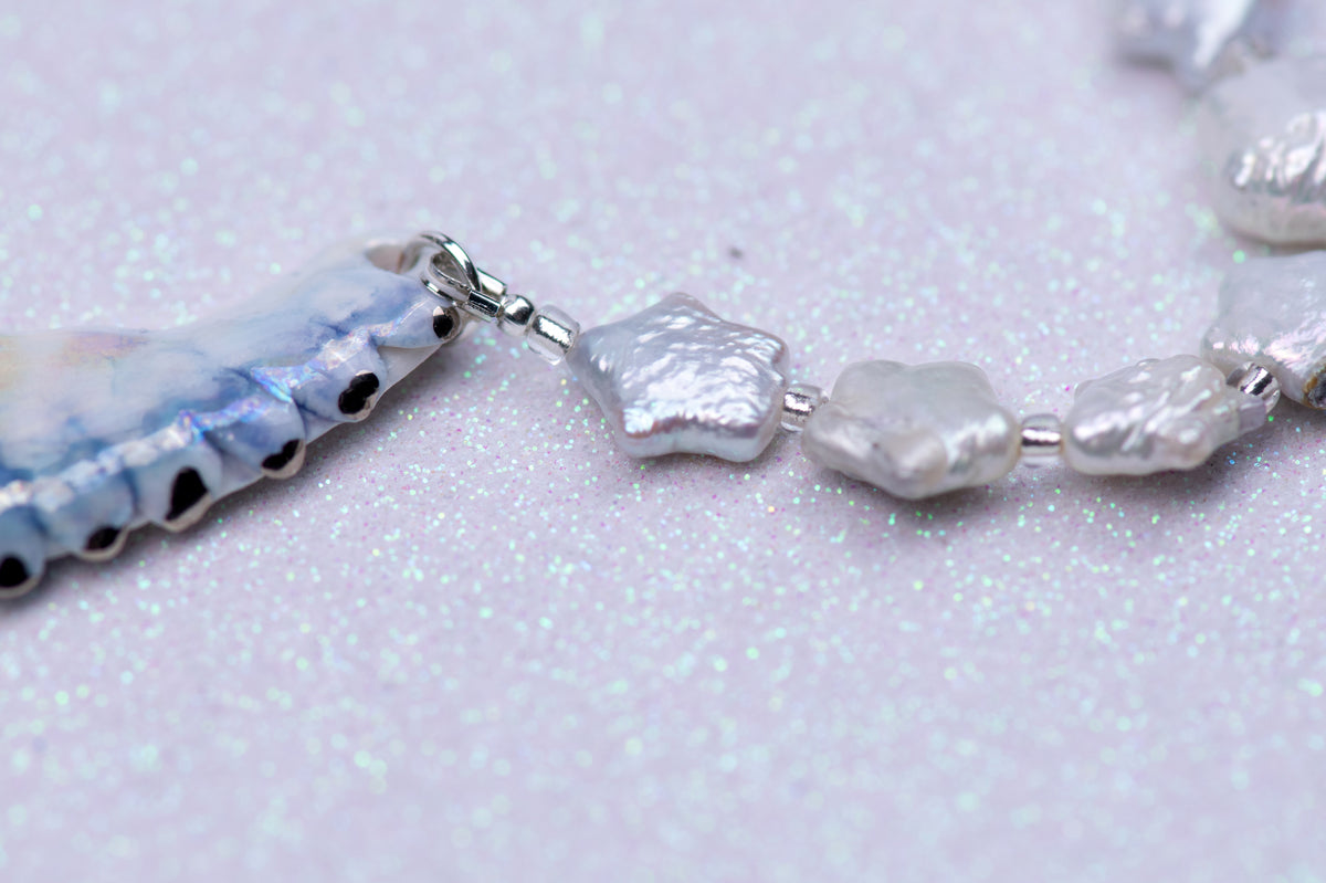Celestial bird with pearl stars necklace