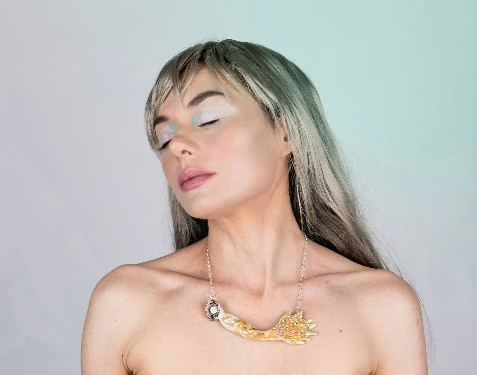 Mermaid carrying pearl necklace