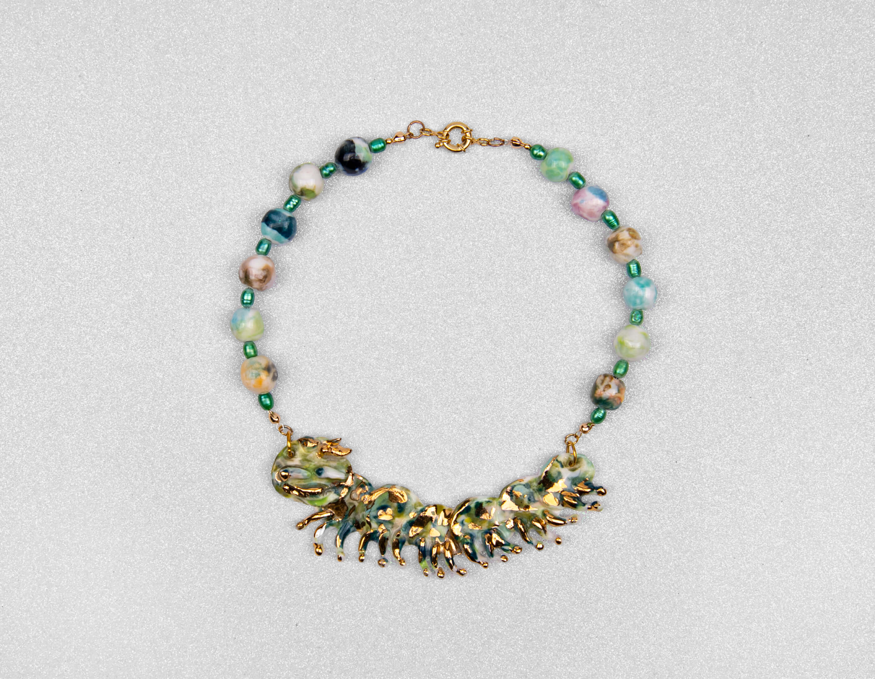 Gold and green caterpillar chocker