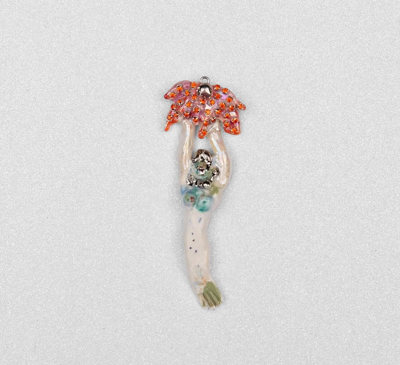 Mermaid carrying red flower charm