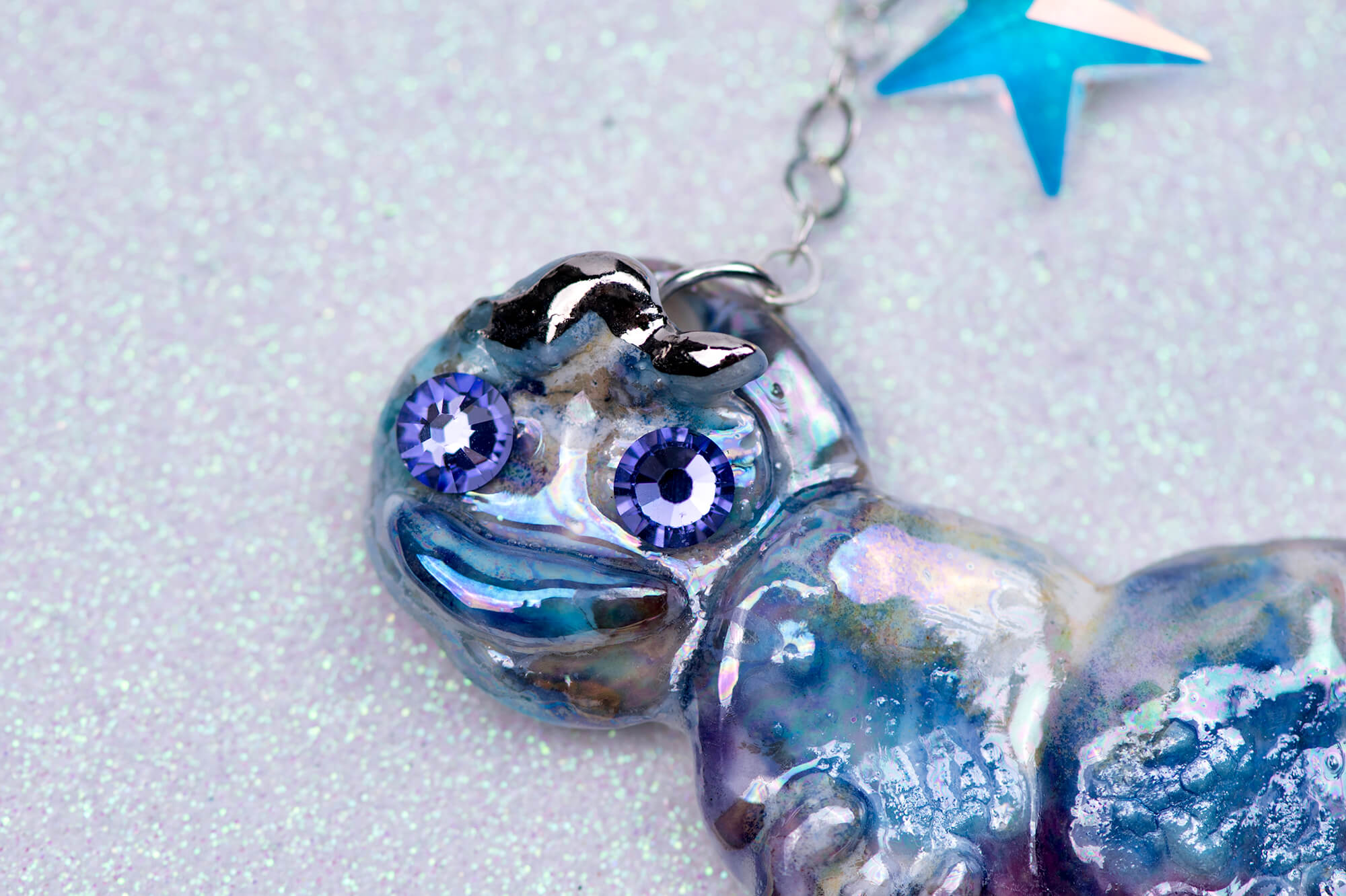 Purple caterpillar necklace with crystal star