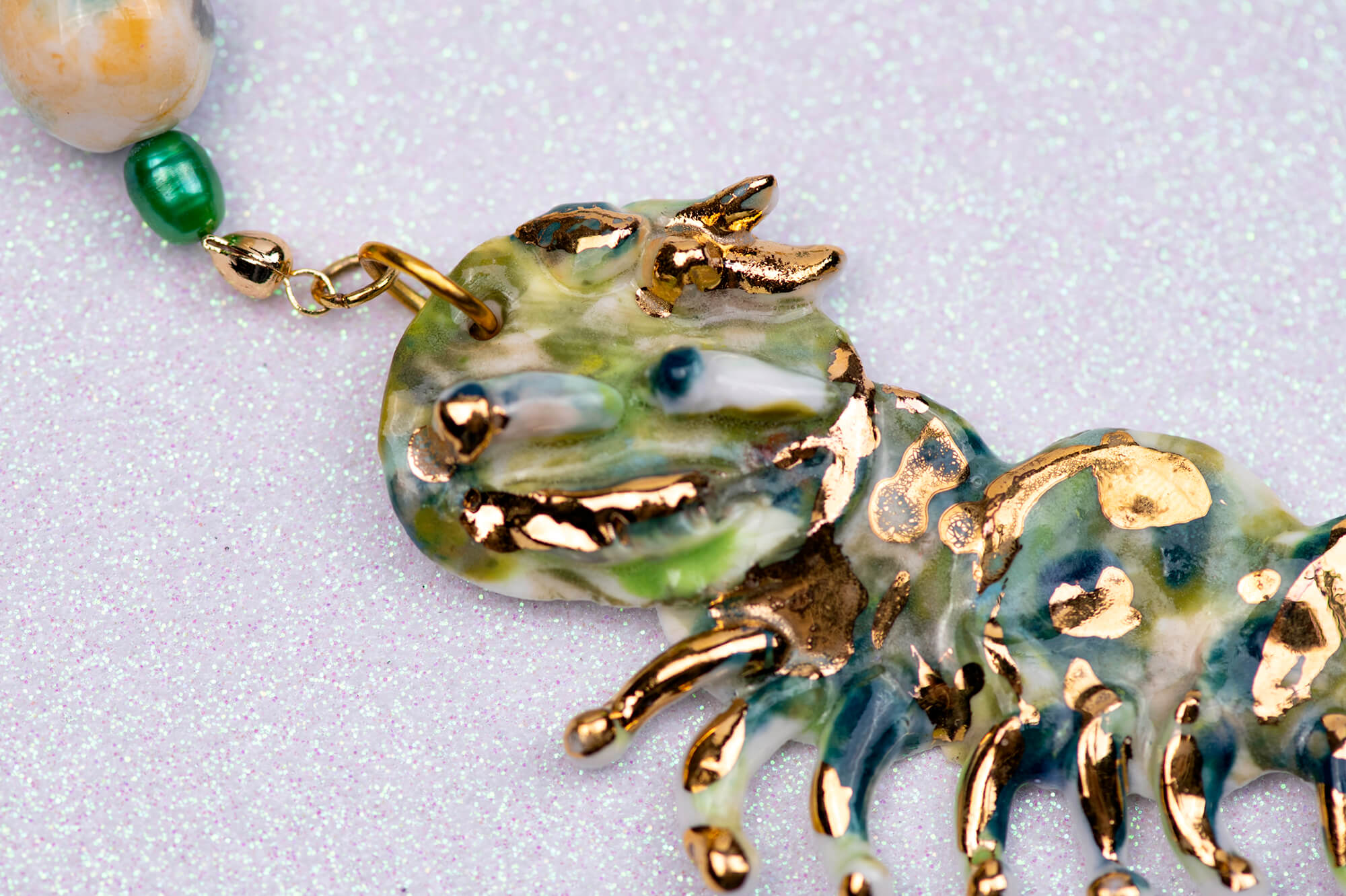 Gold and green caterpillar chocker