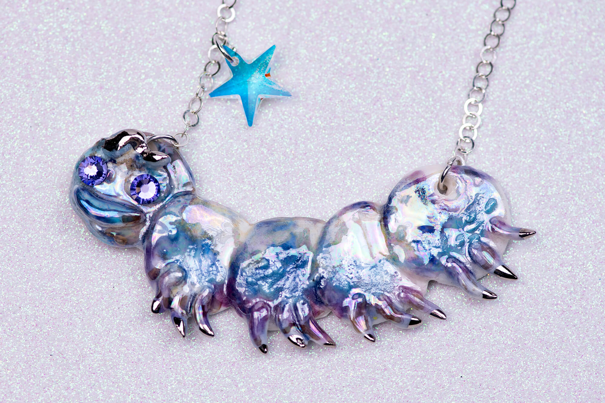 Purple caterpillar necklace with crystal star