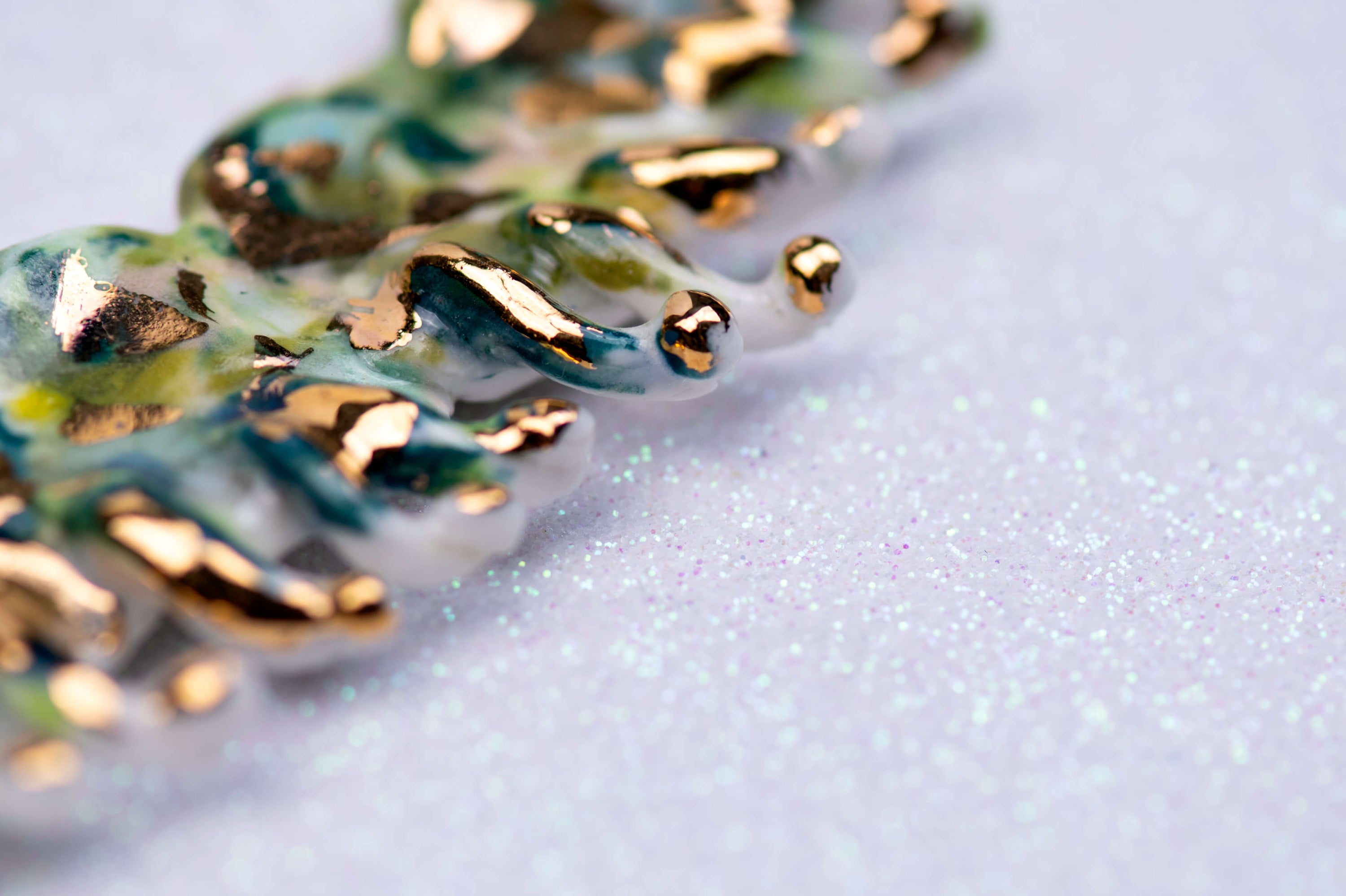 Gold and green caterpillar chocker