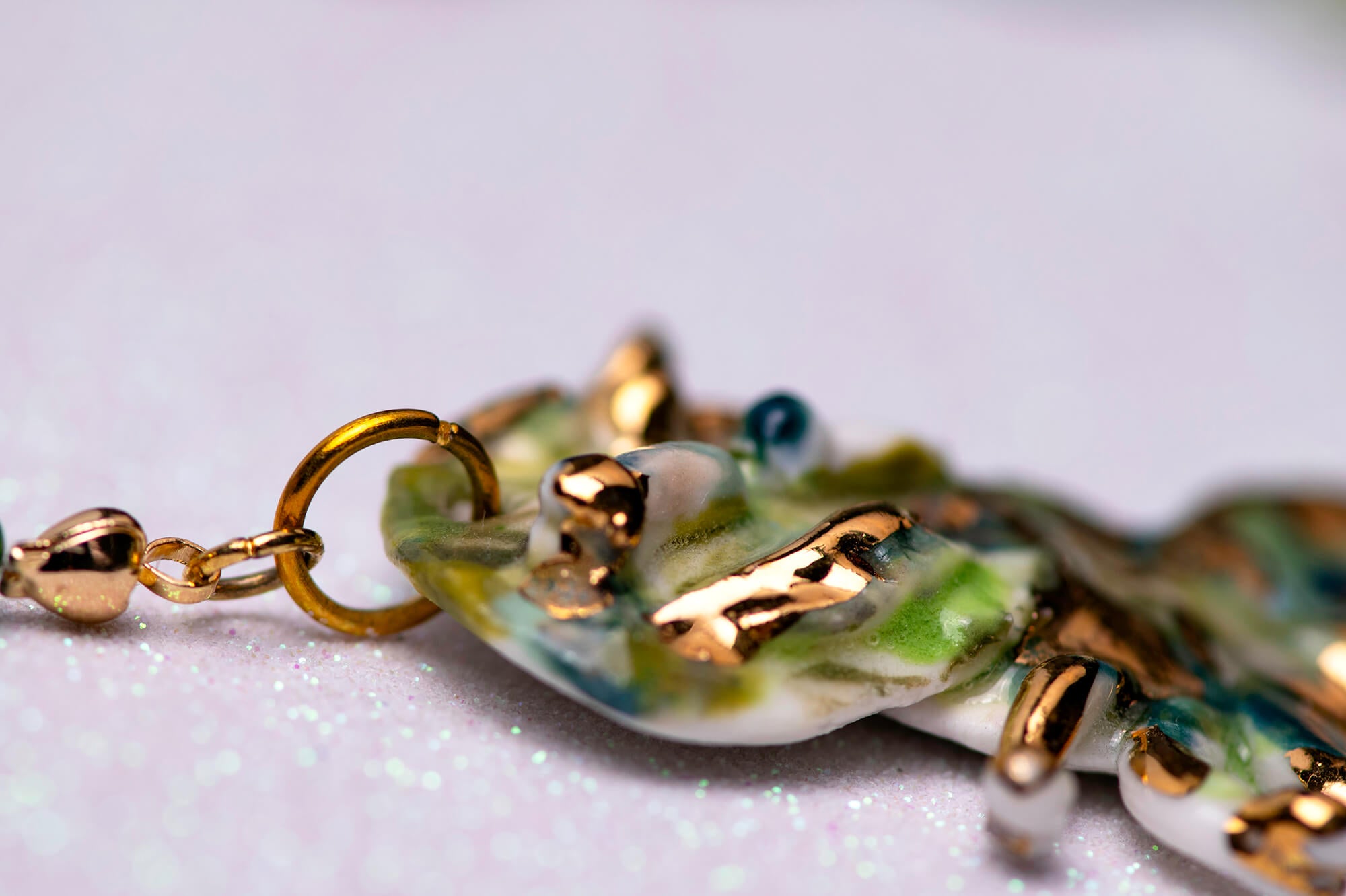 Gold and green caterpillar chocker