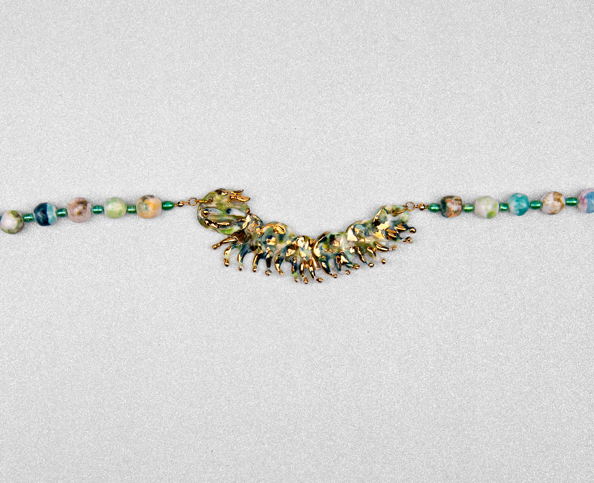 Gold and green caterpillar chocker