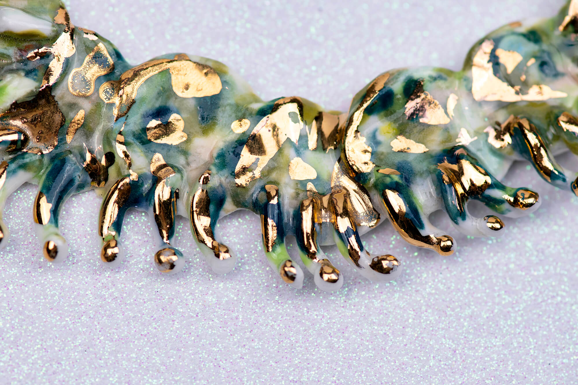 Gold and green caterpillar chocker