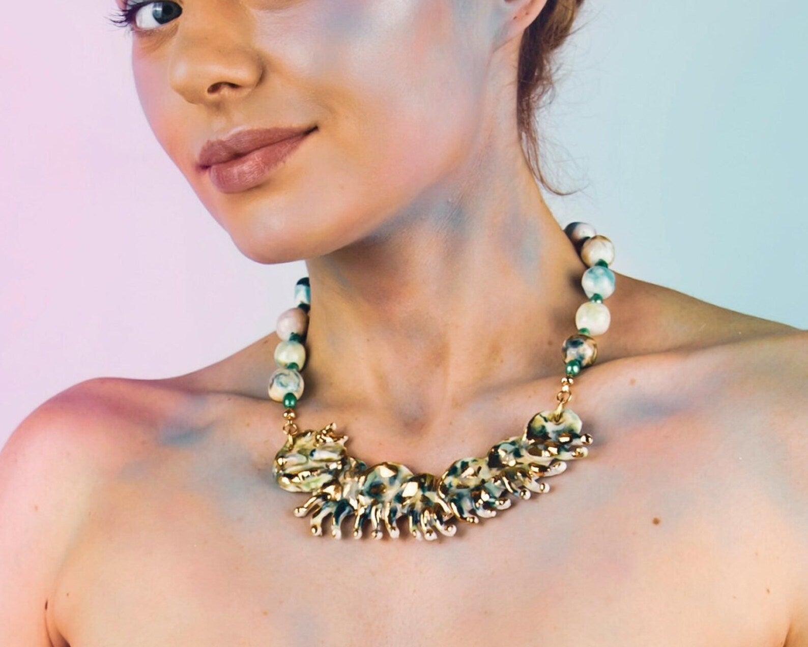 Gold and green caterpillar chocker