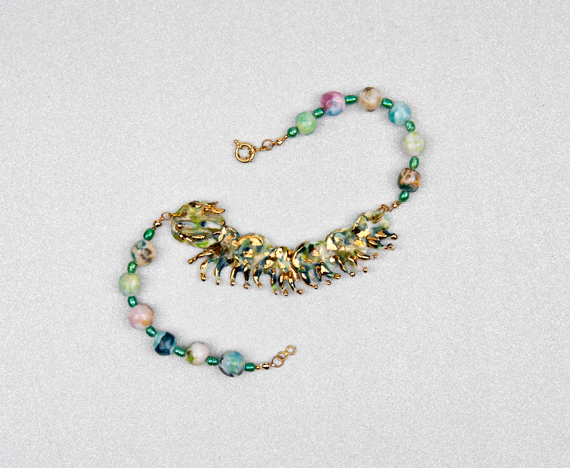 Gold and green caterpillar chocker