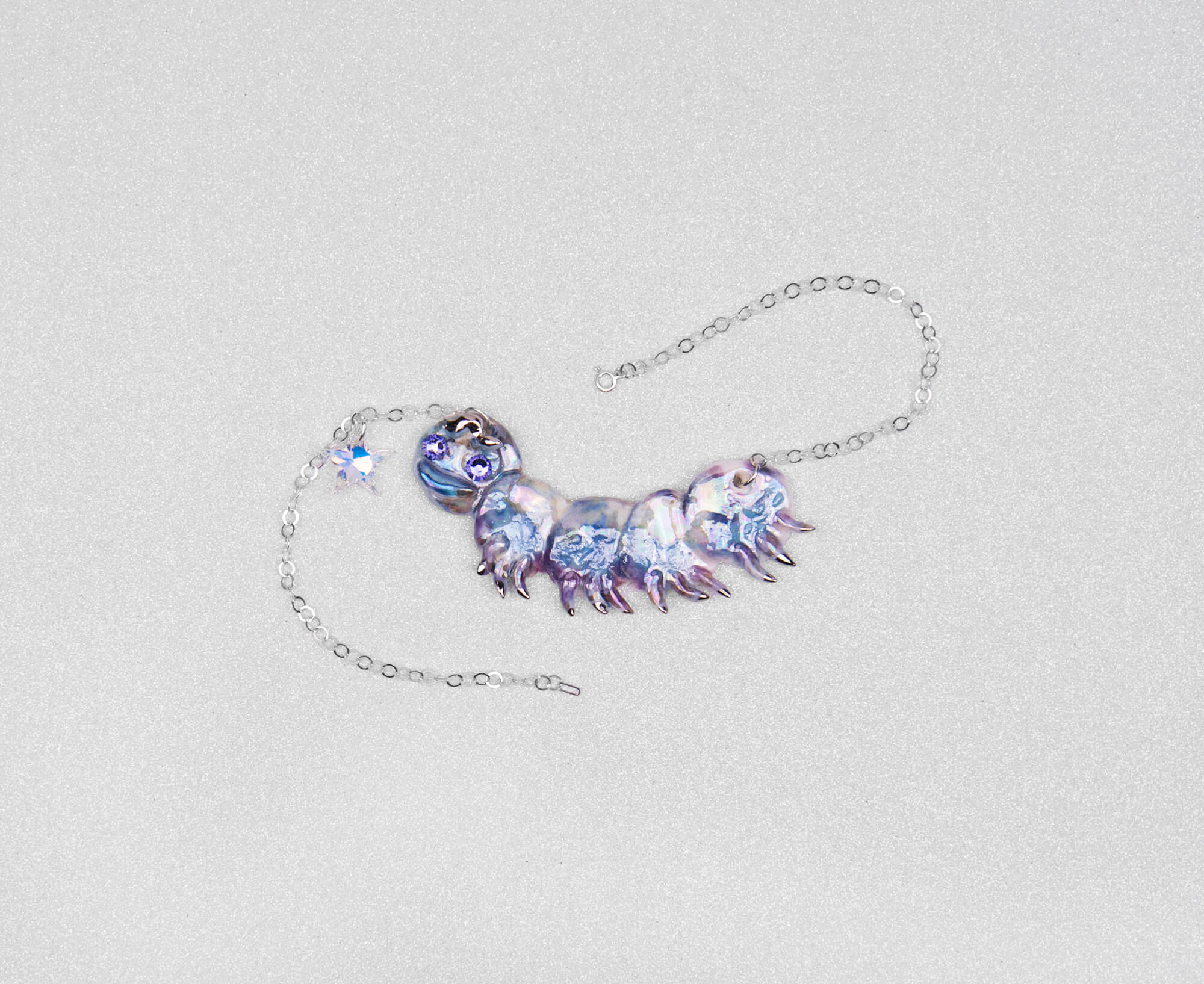 Purple caterpillar necklace with crystal star