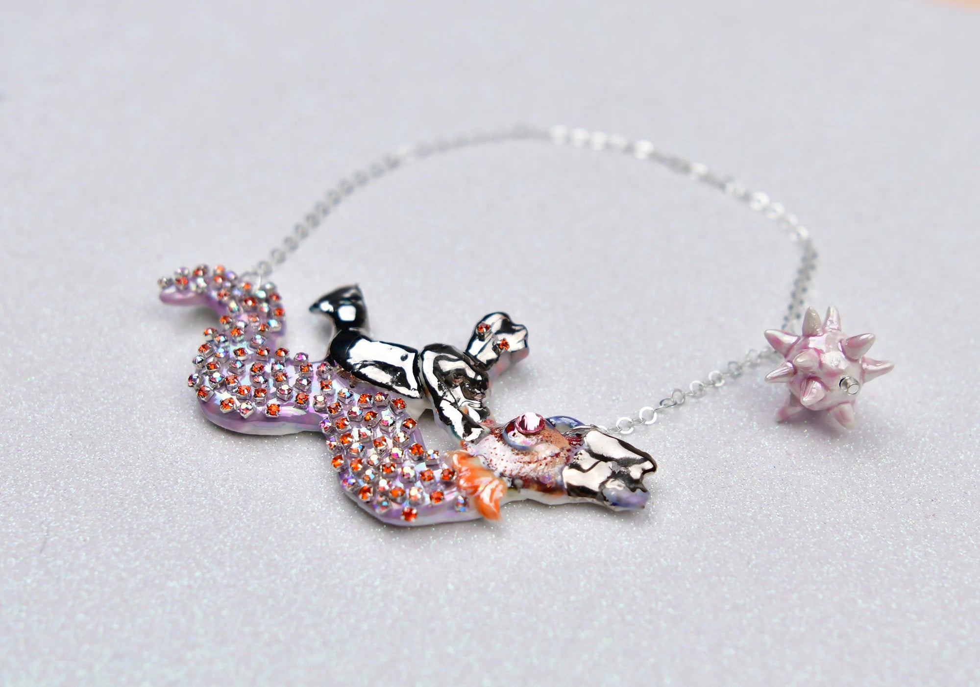 Mermaid riding sea snake necklace