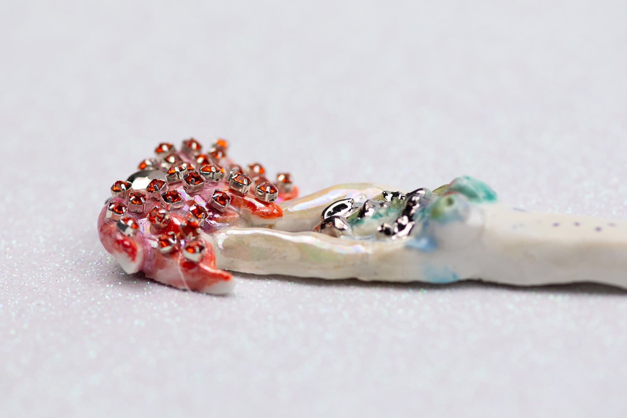 Mermaid carrying red flower charm