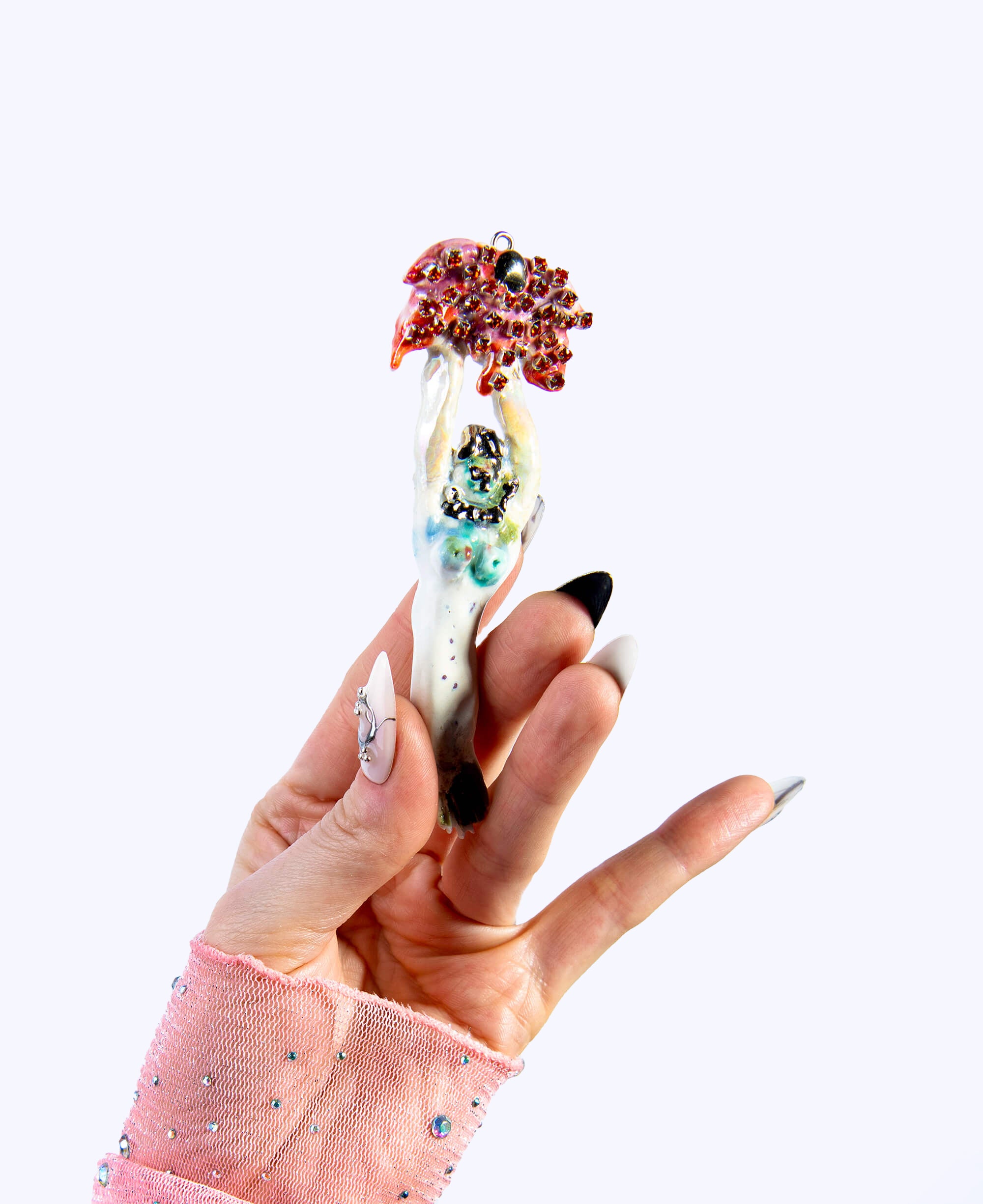 Mermaid carrying red flower charm