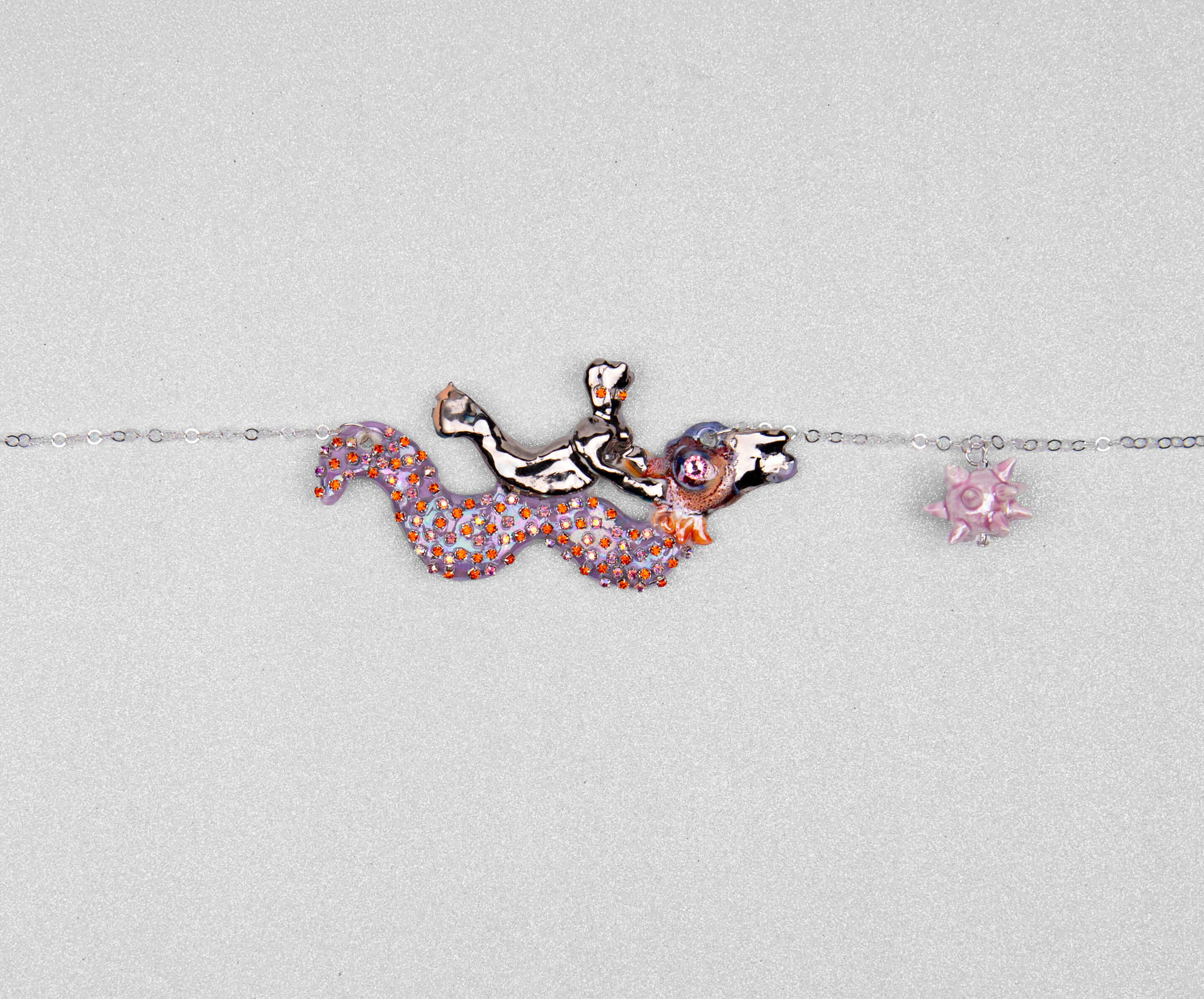 Mermaid riding sea snake necklace