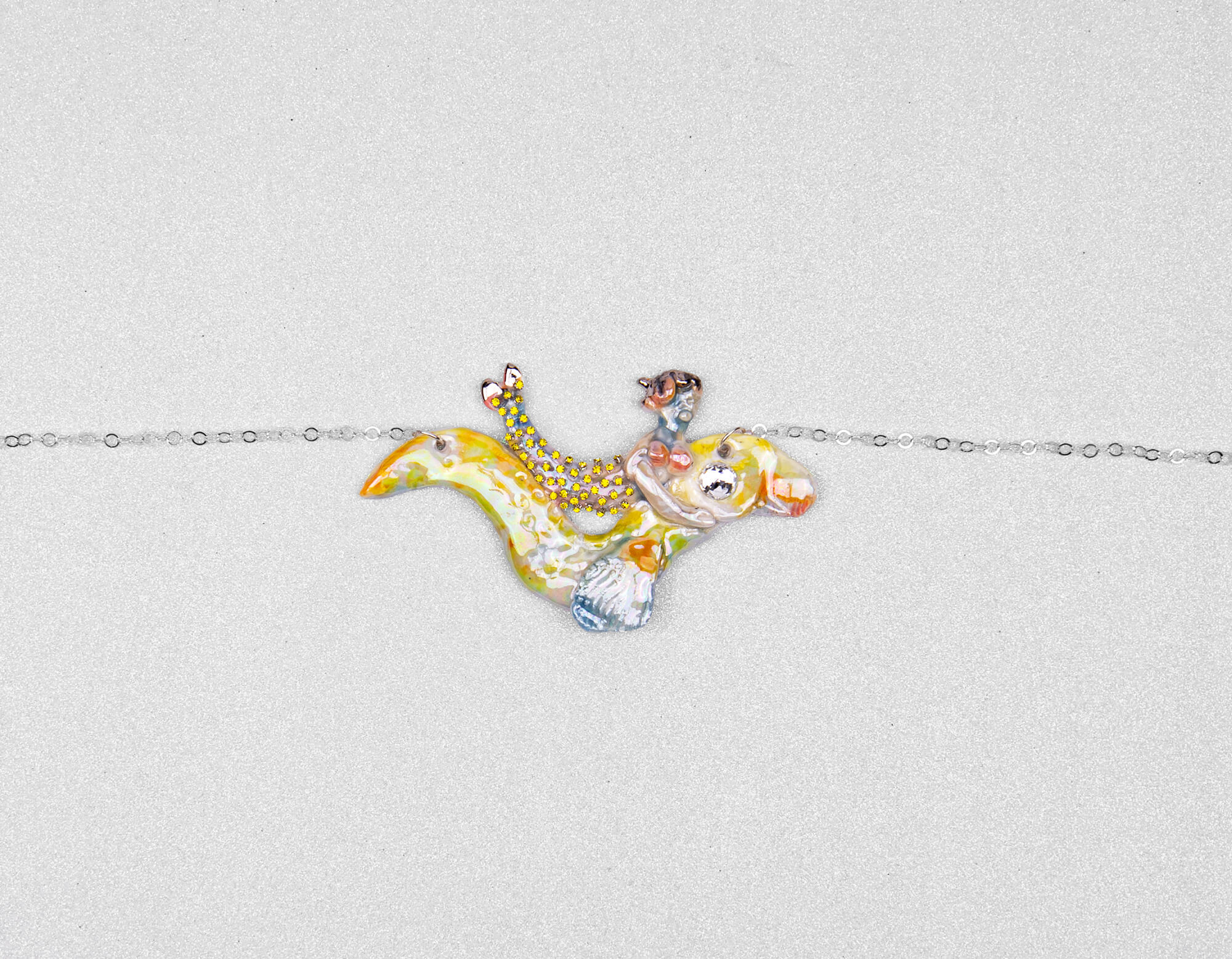 Mermaid riding yellow sea snake