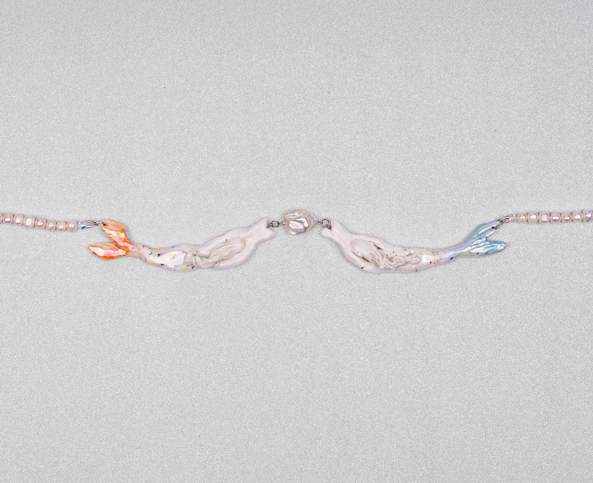 Pastel mermaids with big pearl necklace