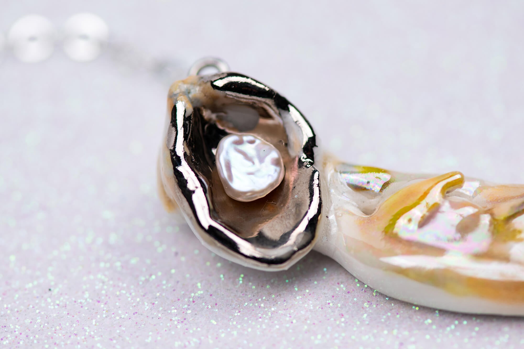 Mermaid carrying pearl necklace