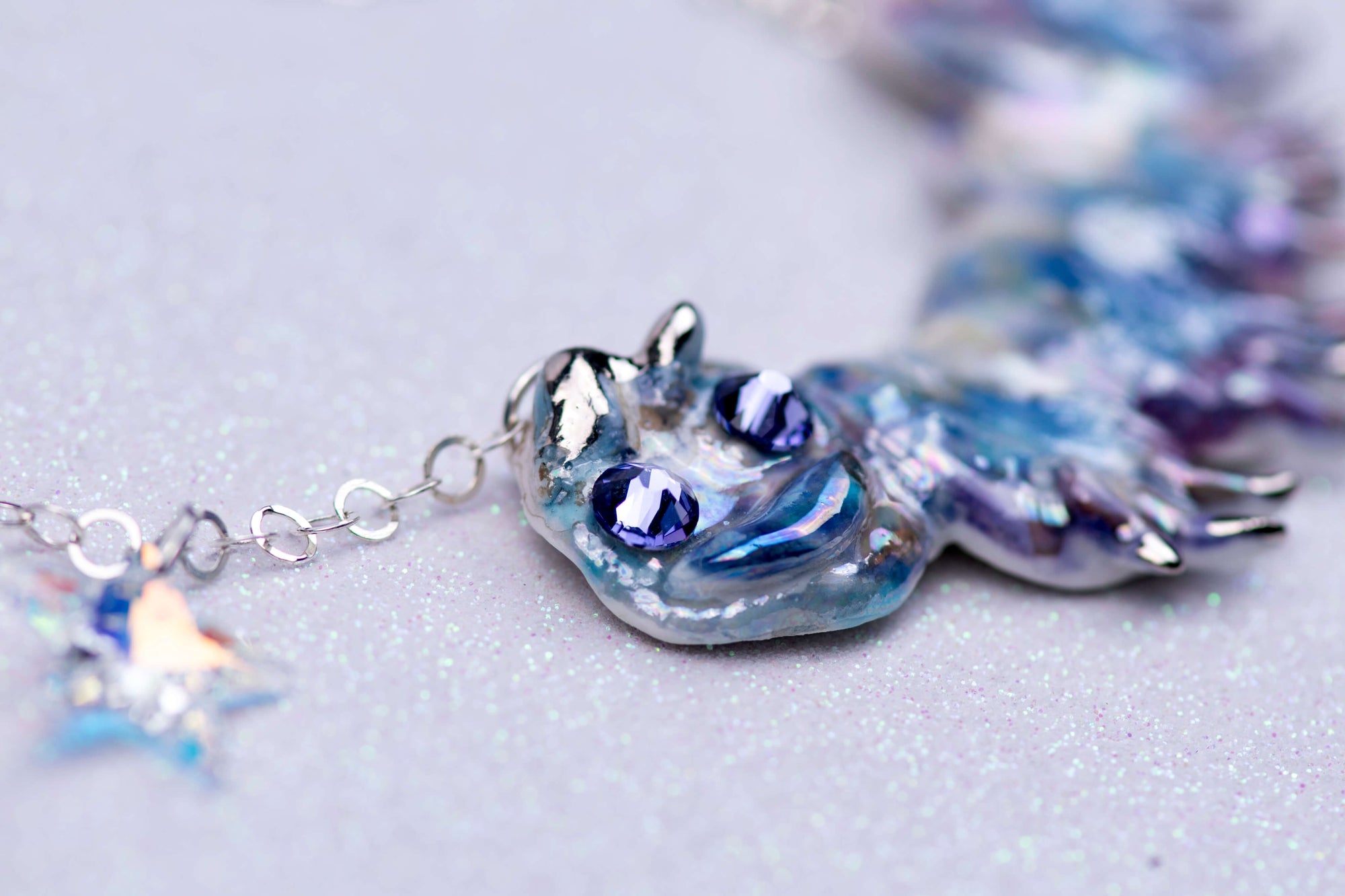 Purple caterpillar necklace with crystal star