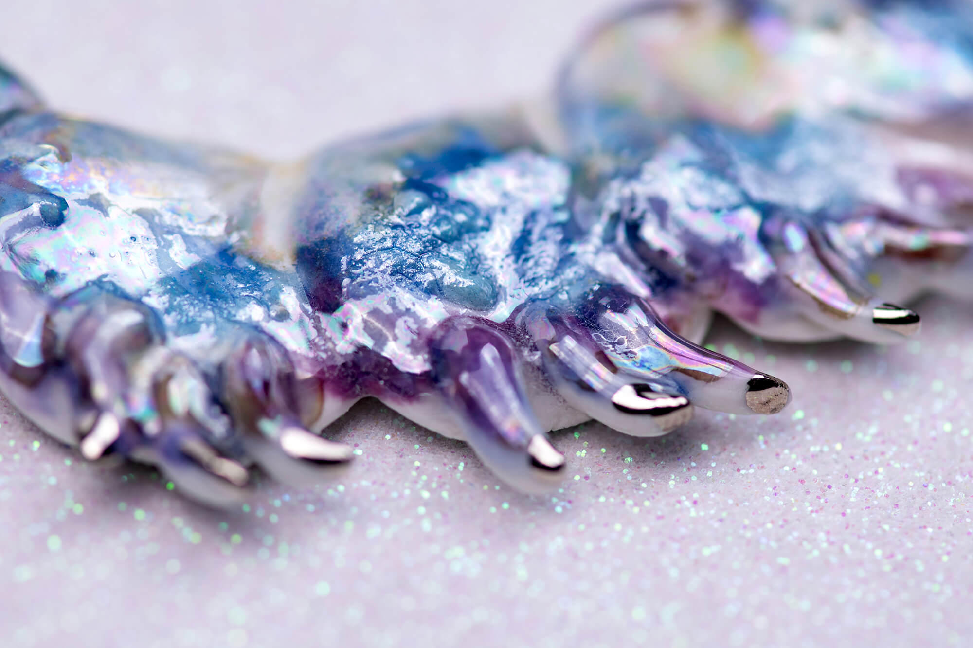 Purple caterpillar necklace with crystal star