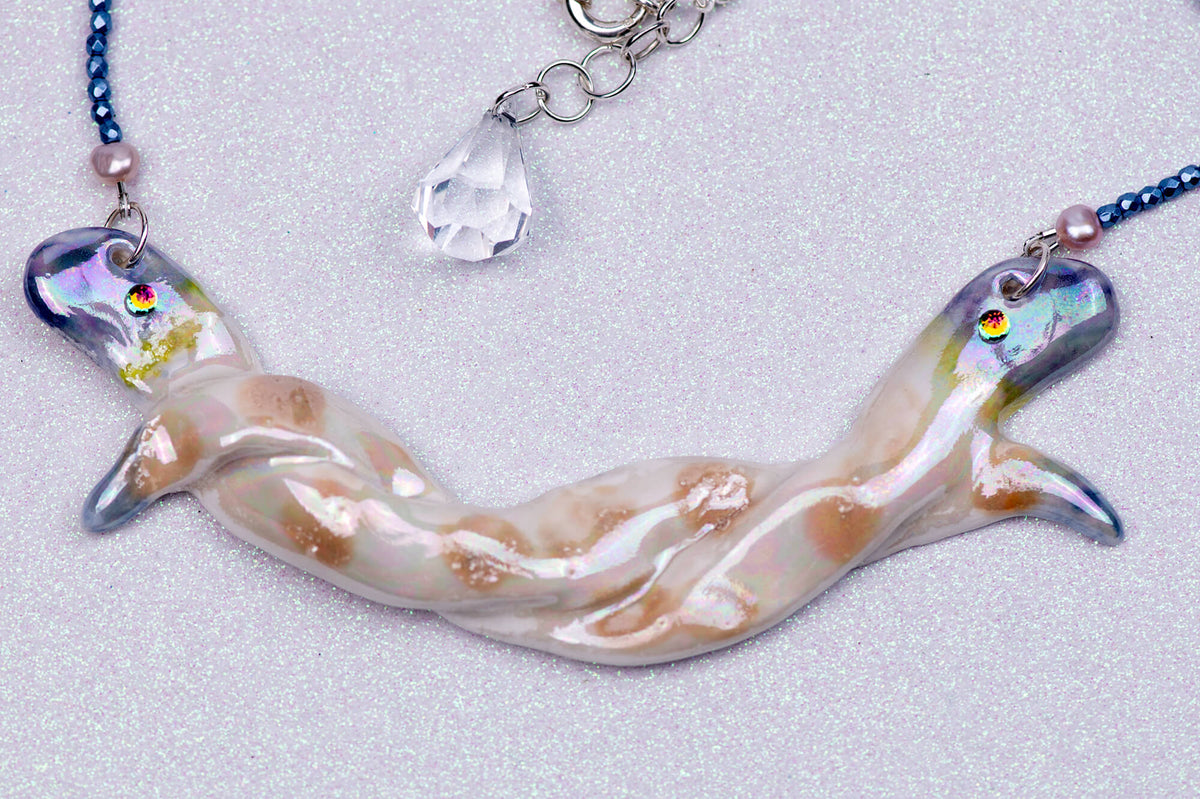 Entwined snakes necklace