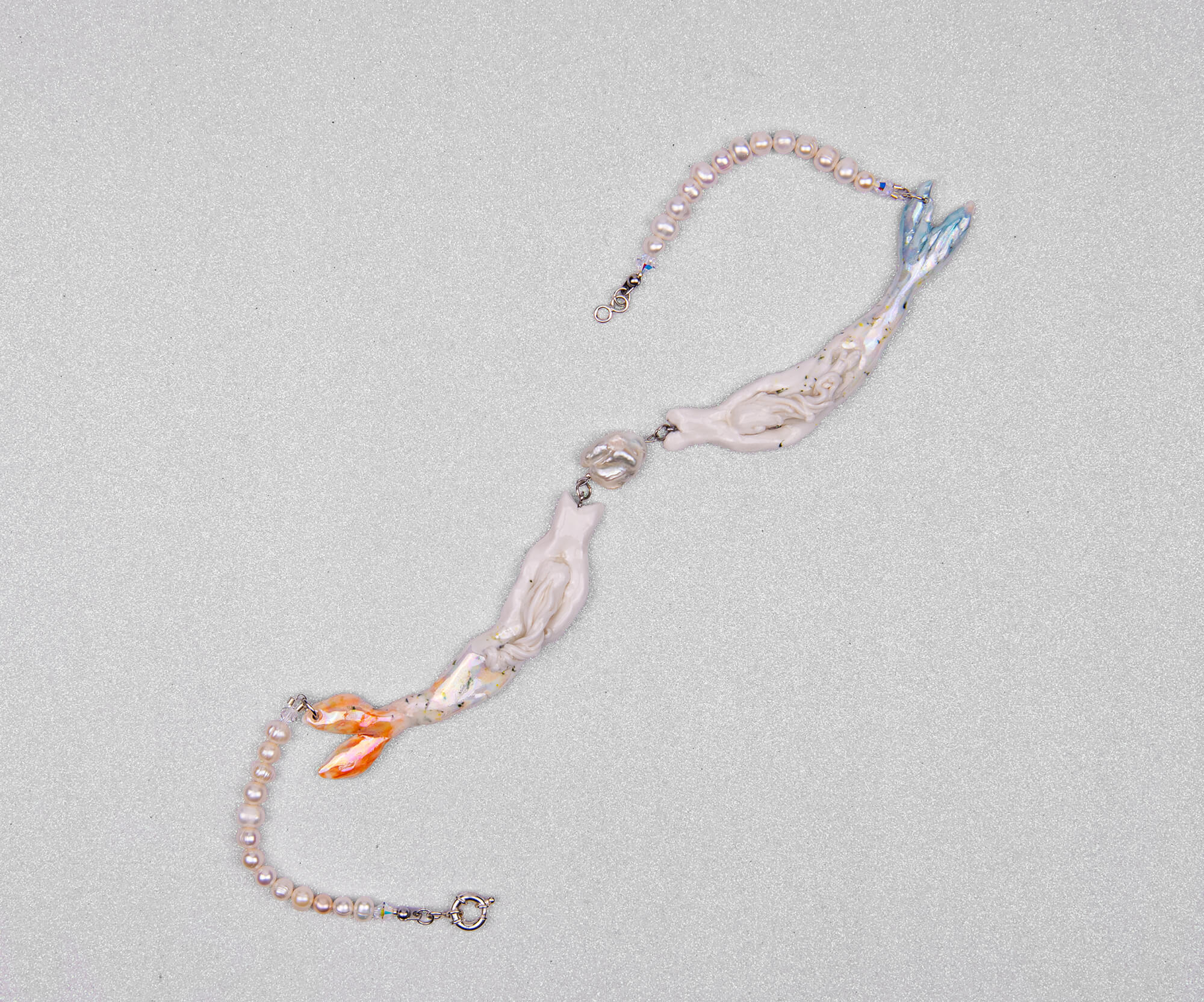 Pastel mermaids with big pearl necklace