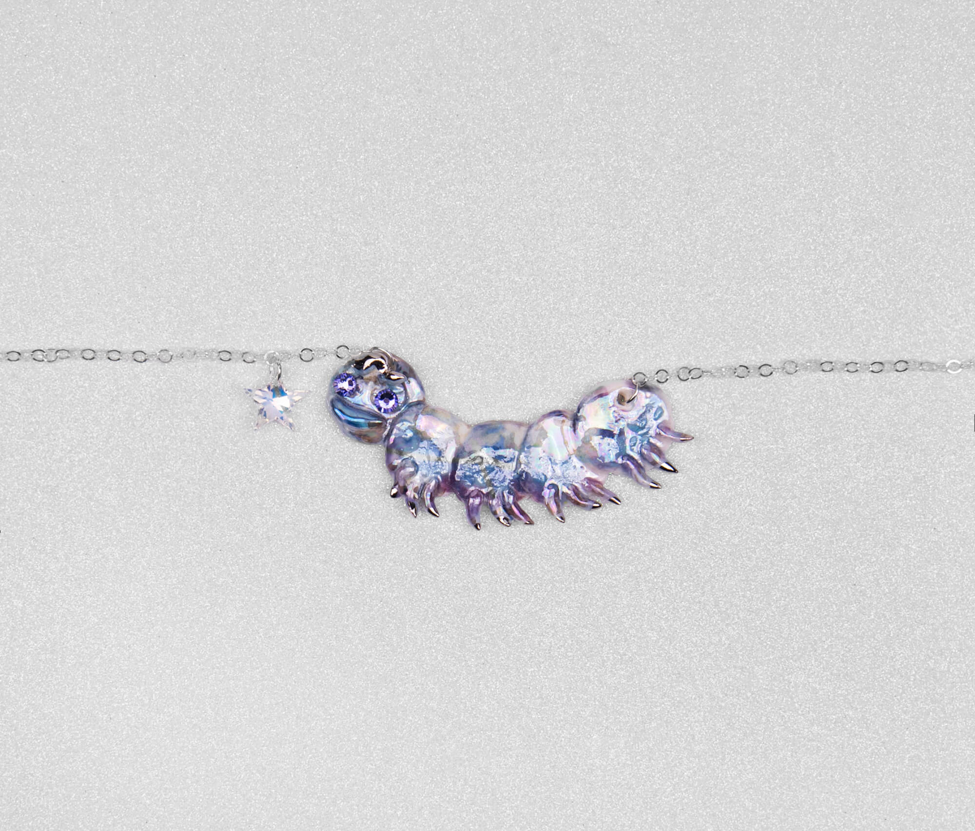 Purple caterpillar necklace with crystal star