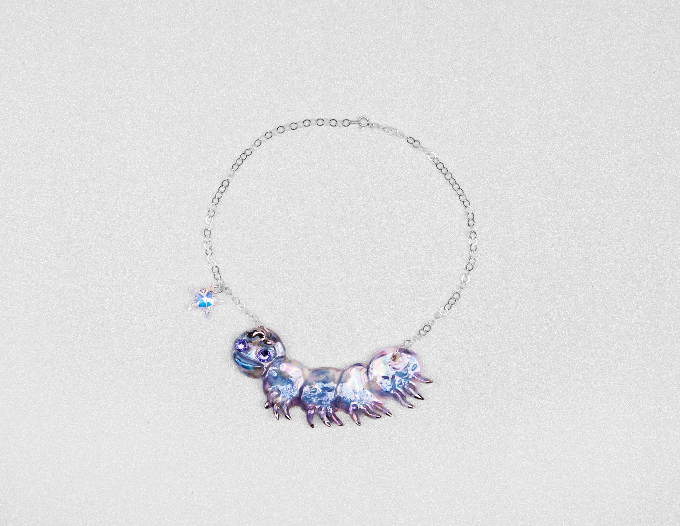 Purple caterpillar necklace with crystal star
